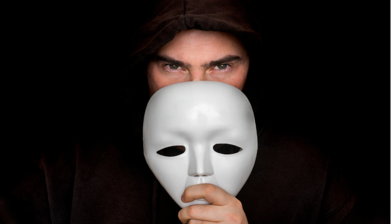 File:Man behind mask.png